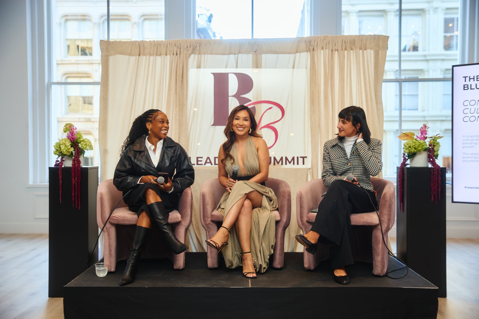 Three women on stage at the 2025 Leaders Summit panel discussion