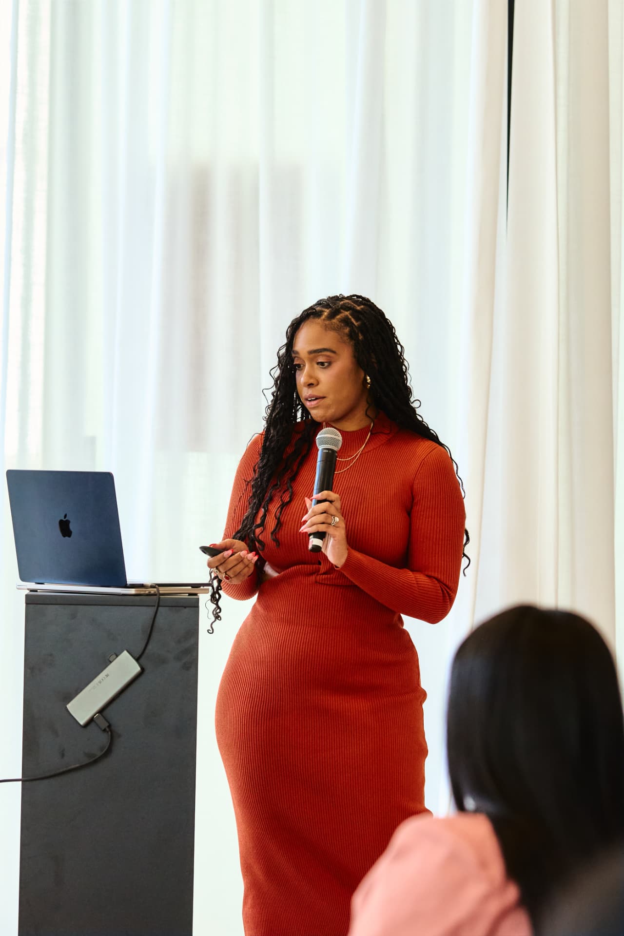 Speaker presenting at a Boardroom Beauty gathering